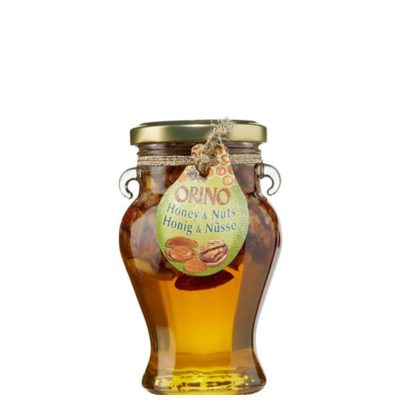 Glazen pot Orino honing met gemengde noten, 250 gram, gevuld met pure Kretenzische bloemenhoning en een mix van amandelen, hazelnoten en walnoten. Rijk, aromatisch en 100% natuurlijk – ideaal voor ontbijt, desserts of als gezonde snack.