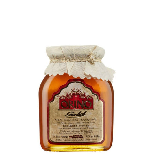 Glazen pot Orino Honing Nectar Goud, 450 gram, gevuld met pure Kretenzische bloemenhoning met aroma van tijm, dennenbloesem en wilde kruiden. Rijk van smaak, 100% natuurlijk, glutenvrij en afkomstig uit Rethymno, Noordwest-Kreta.