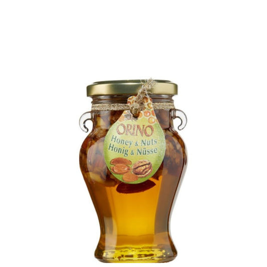 Glazen pot Orino honing met gemengde noten, 250 gram, gevuld met pure Kretenzische bloemenhoning en een mix van amandelen, hazelnoten en walnoten. Rijk, aromatisch en 100% natuurlijk – ideaal voor ontbijt, desserts of als gezonde snack.