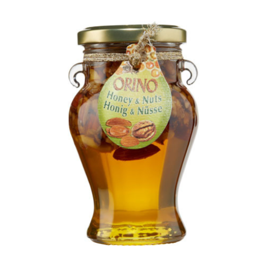 Kretenzische honing met een mix van knapperige noten. Puur, aromatisch en perfect voor yoghurt, desserts, kaas en ontbijt. Authentieke smaak uit Kreta.