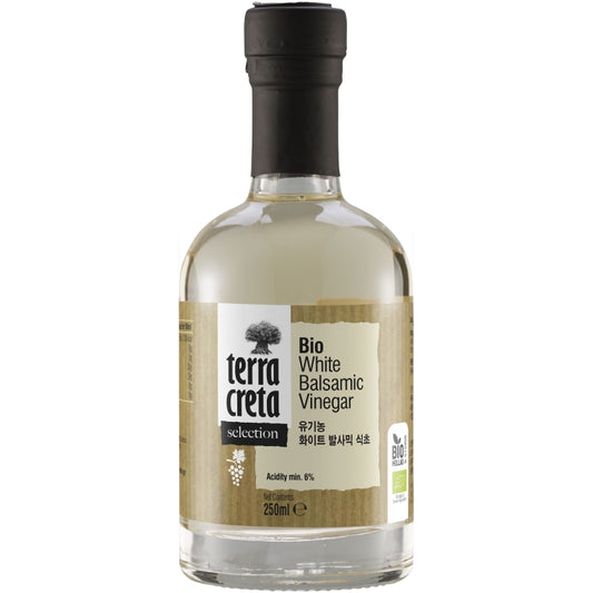 Fles Terra Creta biologische witte balsamicoazijn van 250 ml, gemaakt van Romeiko-druiven uit Kreta, met elegante verpakking en natuurlijke ingrediënten.